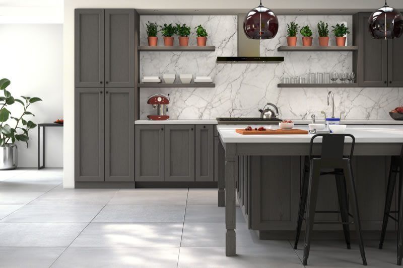Professional kitchen cabinet refinishing in Minneapolis - dark gray shaker cabinets with marble backsplash and island by SIMCO Paint and Restoration